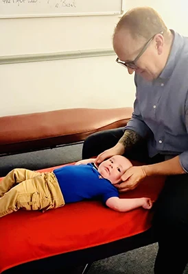 Chiropractor Greenville PA Brent McConnell Adjusting Baby